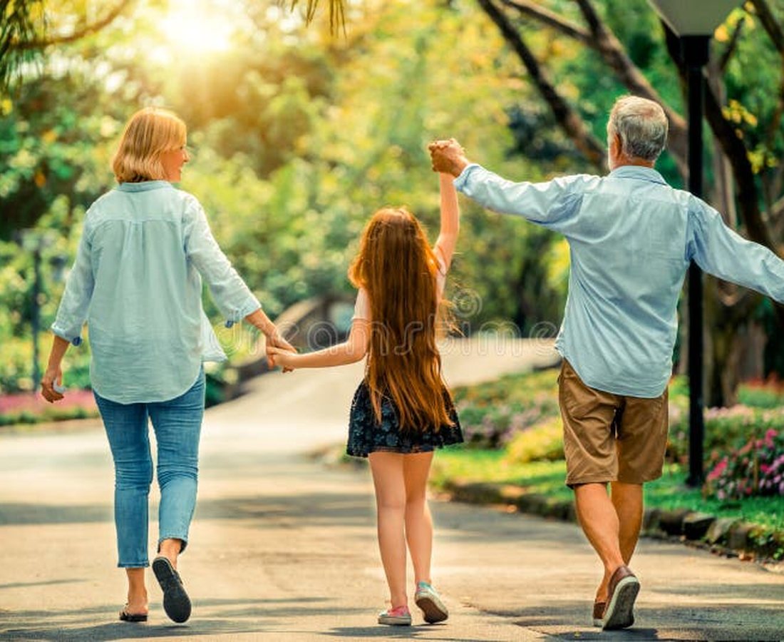 A family walking together outdoors as part of a healthy, active routine