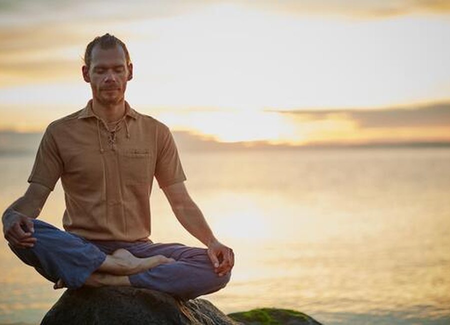 A person sitting calmly in nature during a quiet moment
