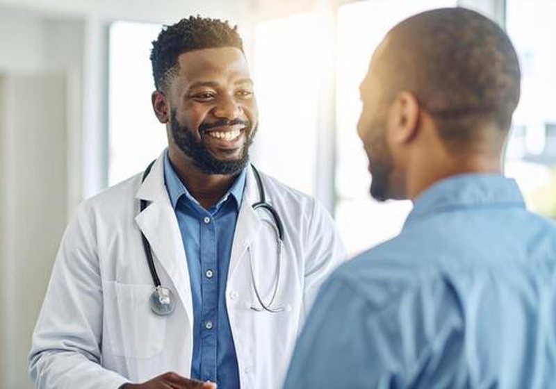 A doctor discussing confidential health concerns with a patient